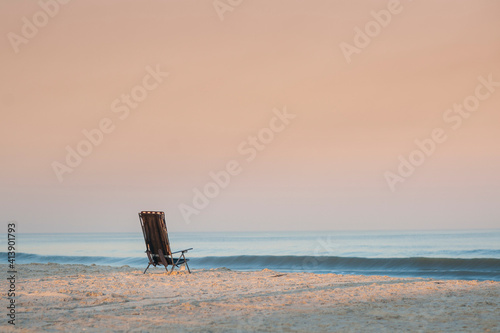 Wallpaper Mural Empty chair at Florida beach against clear sky during sunset Torontodigital.ca