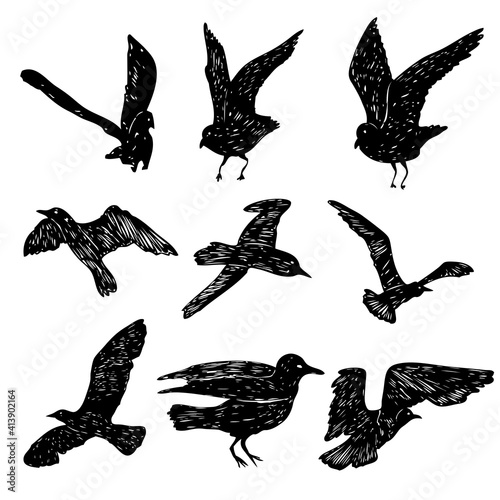 Set of black hand drawn strokes birds seagulls, flock. Drawing sketch of sea birds. On white background. Inspirational body flash tattoo ink. Vector.