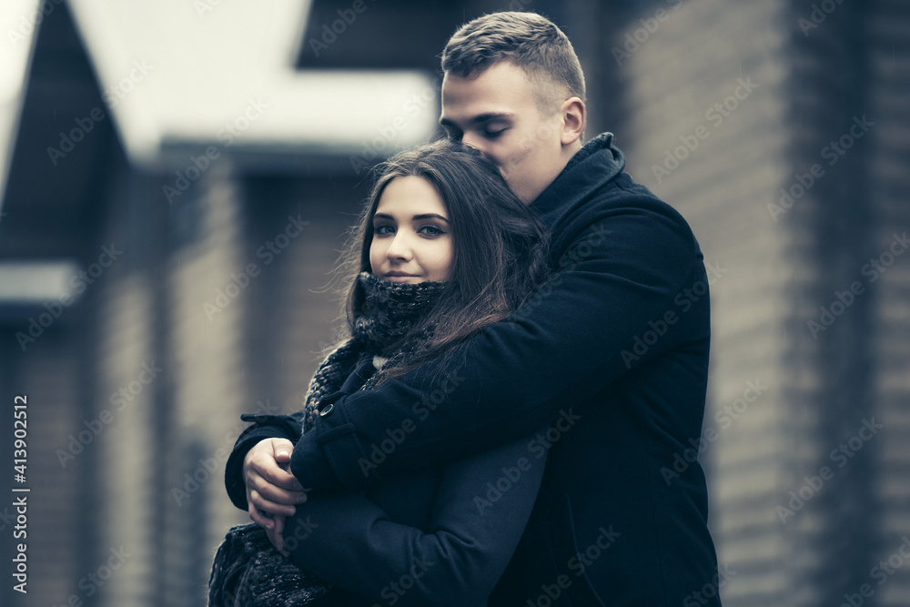 Happy young fashion couple in love embracing outdoor Happy young fashion couple in love embracing outdoor