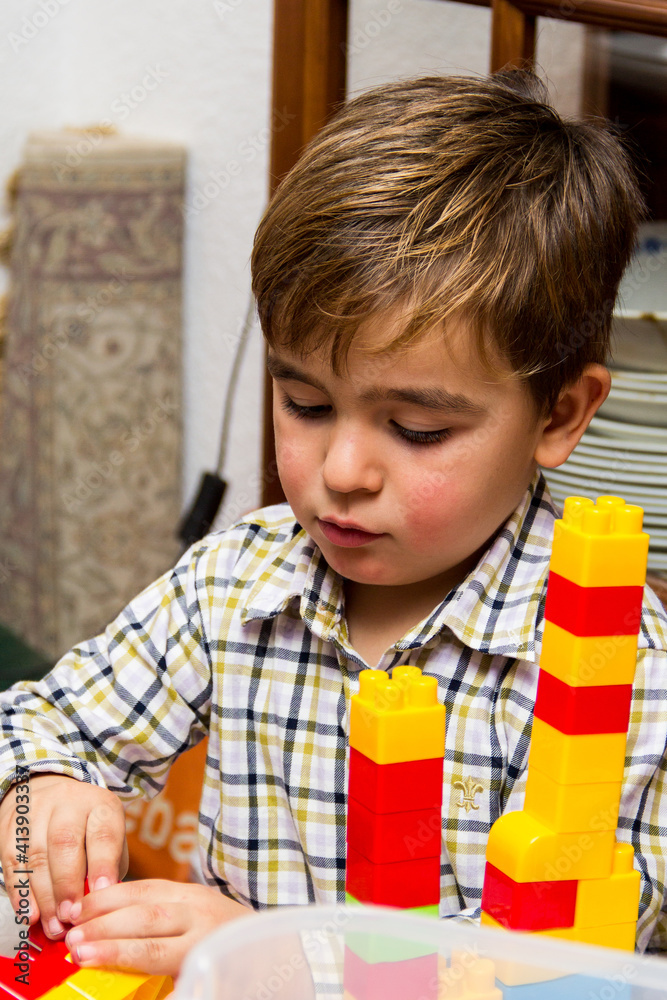 portrait of child playing with construction set portrait of child playing with construction set