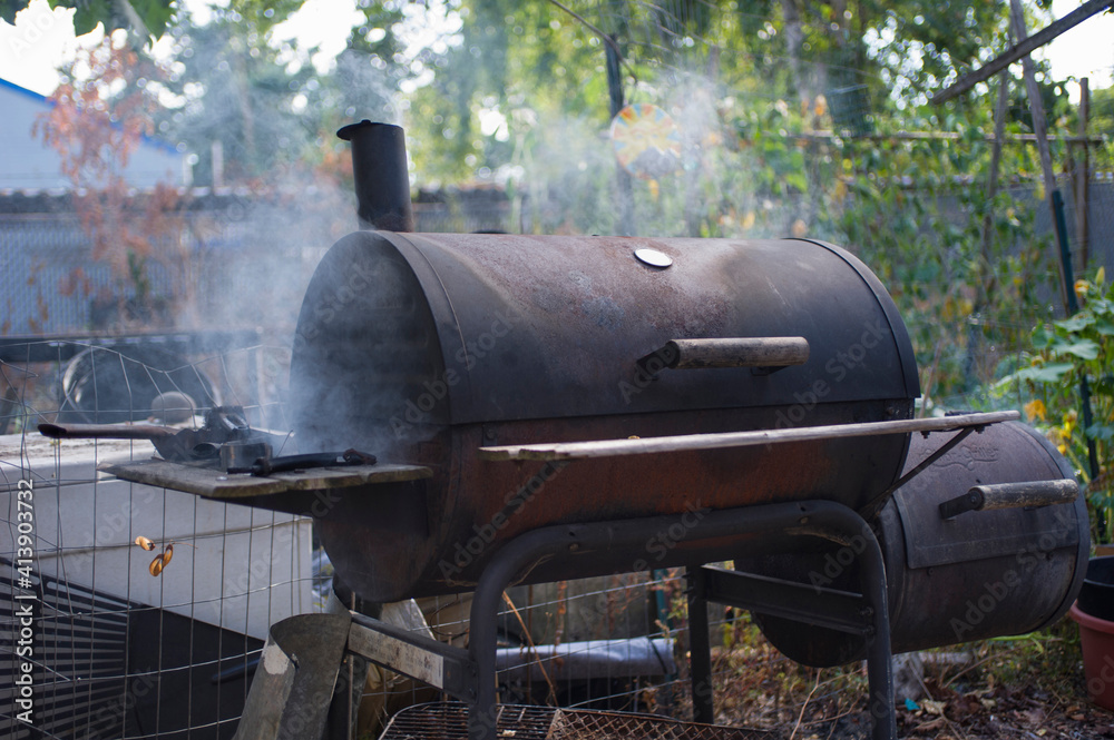 Barbecue against plants in forest Barbecue against plants in forest