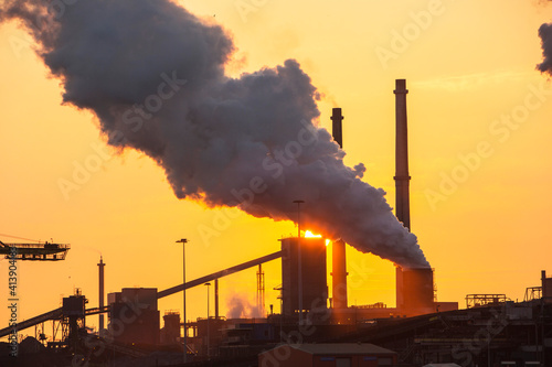Emissions from a Tata steel works in Ijmuiden, Netherlands, at sunset.