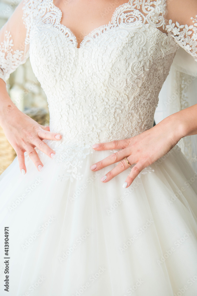 bride holding a dress