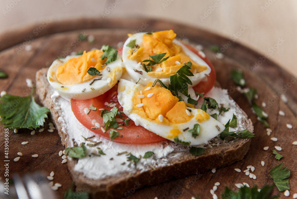 Close up scene on diet sandwich with eggs and tomato Close up scene on diet sandwich with eggs and tomato