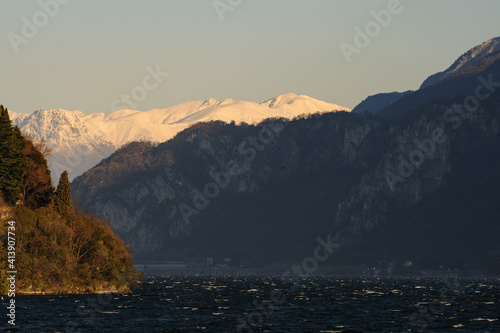 Veduta del lago di Lecco circondato dalle Prealpi Orobiche al tramonto photo