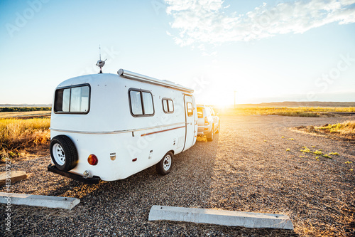 Morning light hitting camper in Montana campsite.