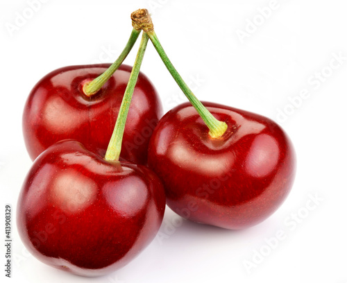 Ripe red cherry bunch on a white background