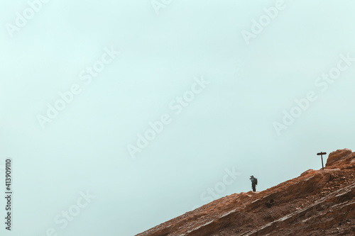 Man with photo camera near Ijen volcano photo