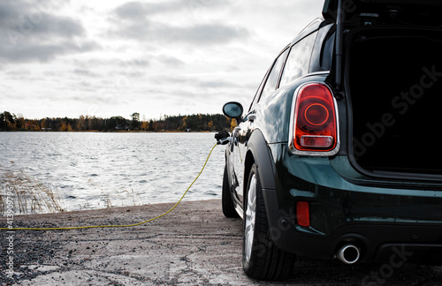 Mini Countryman electric car charging at the beach