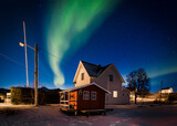 Northern Light Above a Small White House in Stunning Norway