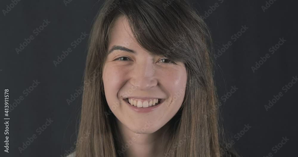 Woman with puffy slanting eyes and smile lines. Woman with puffy slanting eyes and smile lines.
