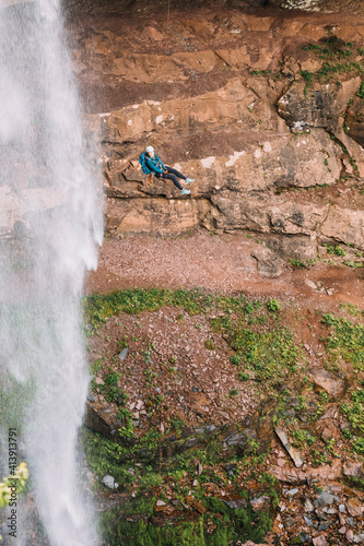 Woman rappels Kaaterskill Falls in upstate New York, New England photo