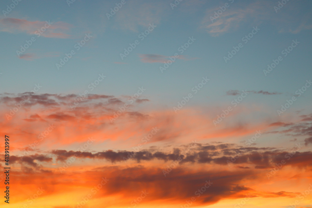 Obraz premium Beautiful sunset sky with clouds of orange and yellow. Natural background