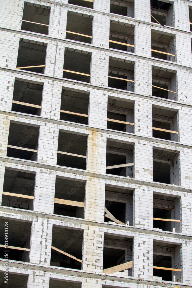 New unfinished multistorey white brick building, copy space New unfinished multistorey white brick building, copy space