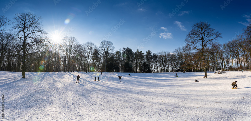Sledging on the Kaiserberg in Duisburg in the sunshine Sledging on the Kaiserberg in Duisburg in the sunshine