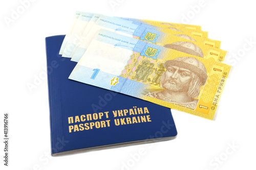 Passport Ukraine with banknotes of Ukrainian hryvnia. The inscription in Ukrainian.
