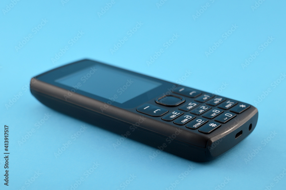 Button mobile phone on a blue background. Button mobile phone on a blue background.