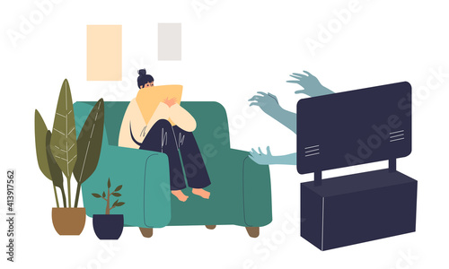 Scared woman watching horror movie at home alone sitting on coach and covering with pillow