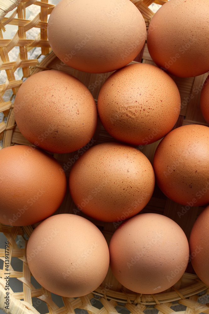 close-up and overhead shot of eggs in a basket.