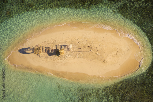 Aerial view of a small isolated wooden hut on the little island of Cayo Arena in Guayubin state, Dominican Republic. photo