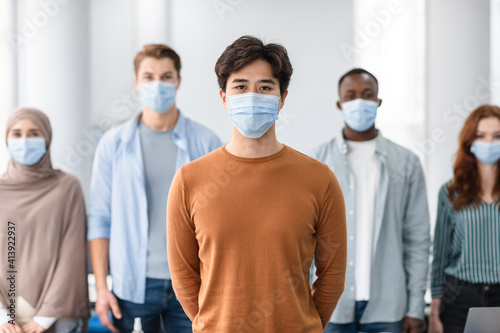 Diverse group of international people wearing medical masks