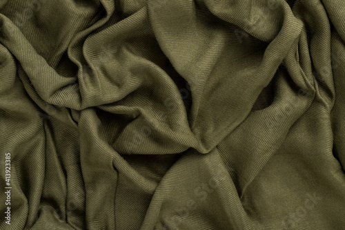 Crumpled linen cloth texture. Wrinkled textile. Green