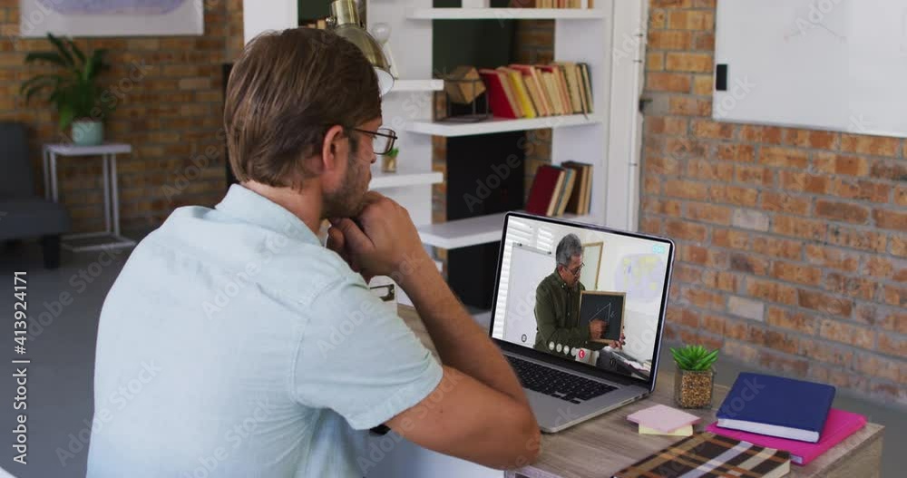 Caucasian male student using laptop on video call with male teacher Caucasian male student using laptop on video call with male teacher