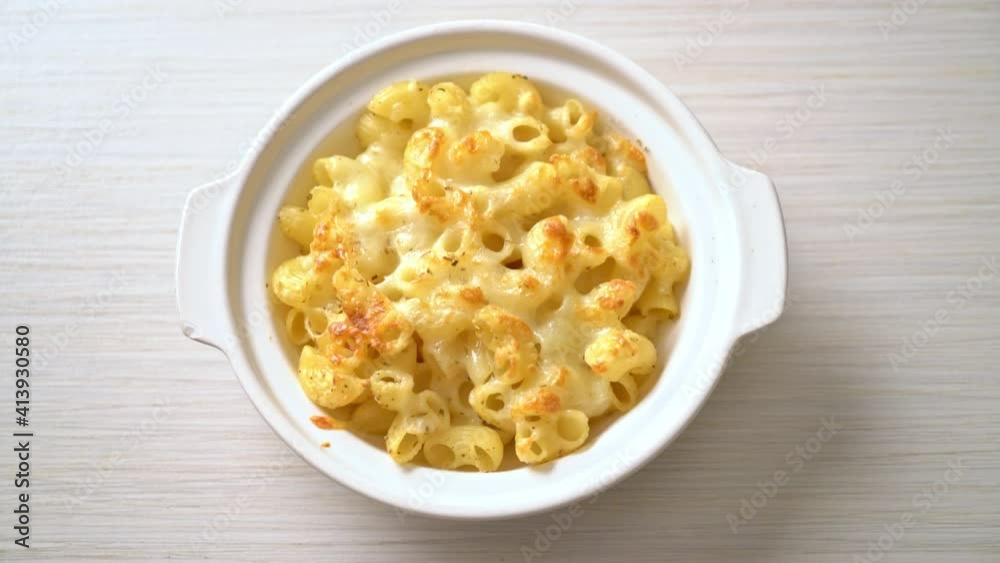 mac and cheese, macaroni pasta in cheesy sauce - American style mac and cheese, macaroni pasta in cheesy sauce - American style
