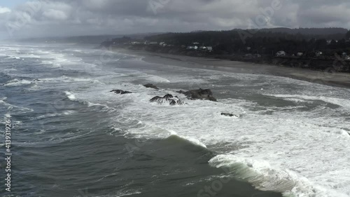Aerial over North Pacific Ocean, Seal Rock, Oregon, dark cloudy afternoon