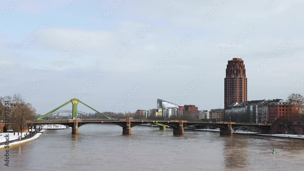 Lindner Hotel And Residence Main Plaza, Ignatz Bubis And Raftsman Bridge Over Main River In Winter At Frankfurt am Main, Germany. - wide shot
