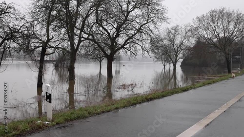 Boat Sails On The River And The People Walks On The Empty Road Of Rüdesheim, Germany. wide shot photo