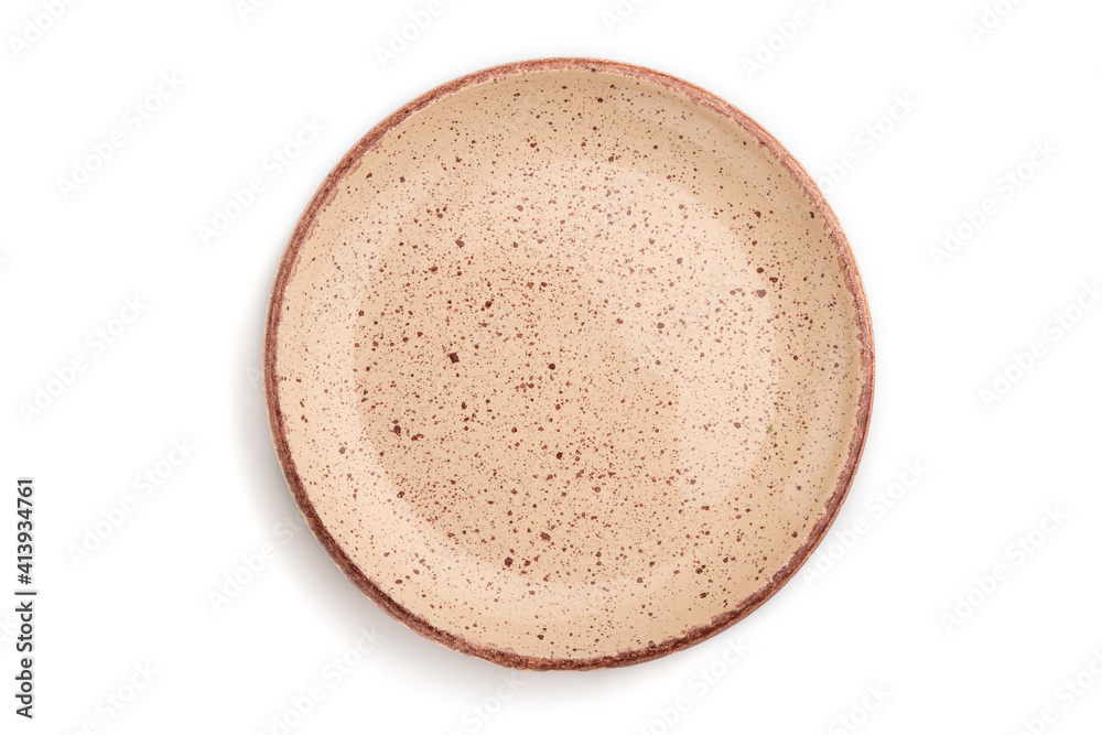 Empty beige dotted ceramic plate isolated on white background. Top view, close up. Empty beige dotted ceramic plate isolated on white background. Top view, close up.