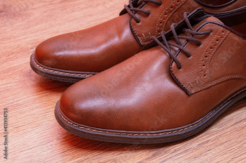 Men's classic pair of brown leather shoes.