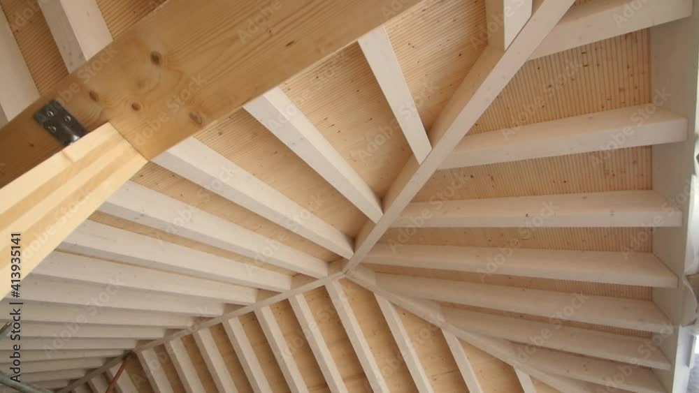 Travelling of a new wooden roof in a residential home with nice woodworking pattern