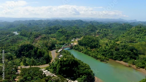 Scenic aerial view, lush green Javanese landscape and Bajulmati bridge Indonesia photo