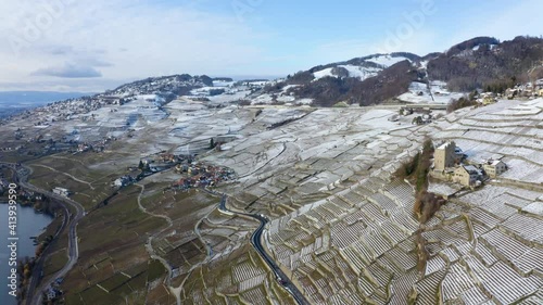 Medieval Tower Of Marsens In Lavaux Vineyard With Epesses And Riex Villages In Background During Winter In Vaud, Switzerland. - Aerial Drone Shot photo