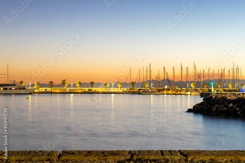 atardecer en el puerto de Burriana con barcos y palmeras de fondo ,Castellón de la plana  ,España photo