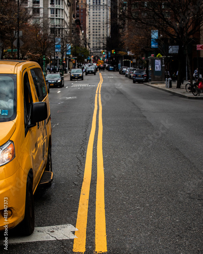 Yellow taxi and road line in new york city