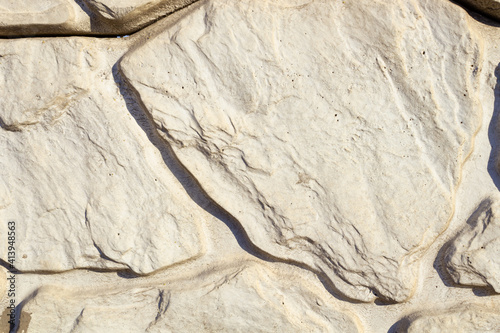 white stones of various sizes create a pattern