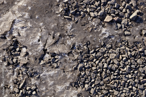 gray small stones lie solid, but there are a few empty places that are even