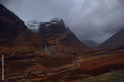 Three Sisters Mountains, Glencoe. Bidean nam Bian in the picture. . Snowy atmosphere in winter, after a big storm. Rain in the environment. Horrible February day in full red alert for weather photo