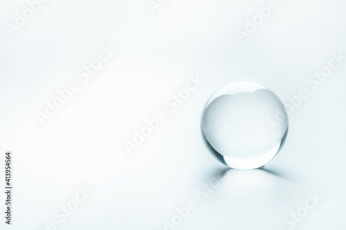 Clear enlighted glass sphere as an idea concept. Minimalistic backdrop for text copy and universal concept utilization