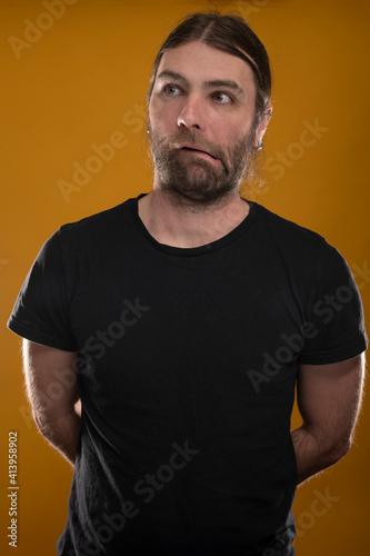 Fotografía Male with long hair making cute grimaces to the camera