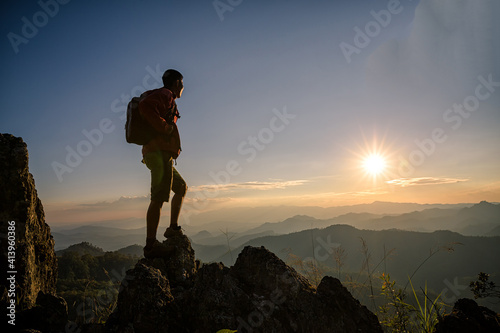 Young man tourist with backpack relaxing