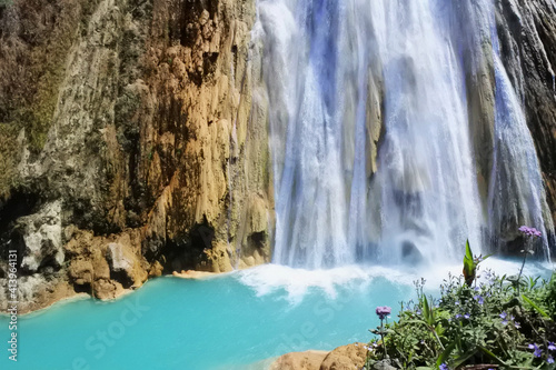 Chiapas, México; 2016: Beautiful turquoise waterfall landscape background