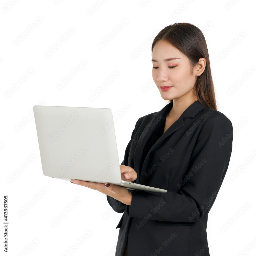 Young asian businesswoman in a black suit holding a laptop computer. Portrait on white background with studio light. Young asian businesswoman in a black suit holding a laptop computer. Portrait on white background with studio light.