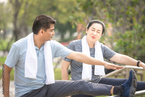 Asian couple exercise in city park on morning concept family, love, freedom , life insurance , retire , healthy strong © Suriyo