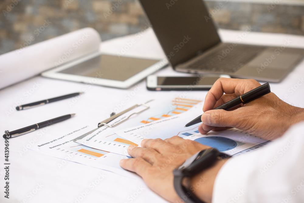Hand working business profit report at workplace business office Hand working business profit report at workplace business office