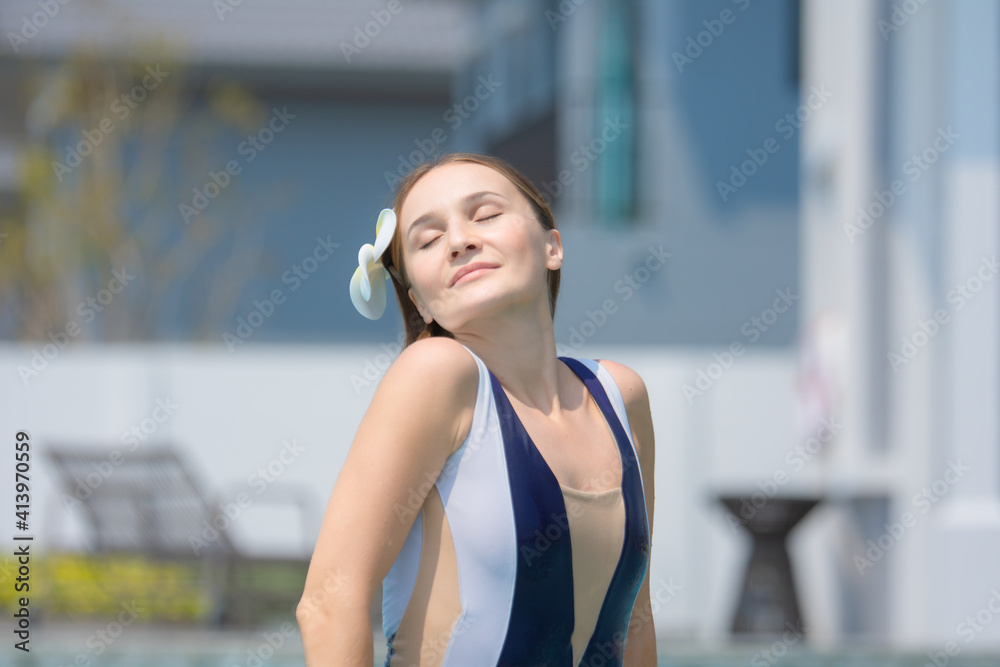 Beautiful women relaxing at swimming pool luxury poolside. woman travel ...
