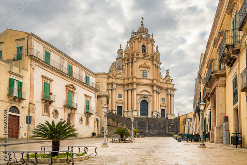 The Duomo of San Giorgio church at empty Duomo square in Ragusa, Sicily photo